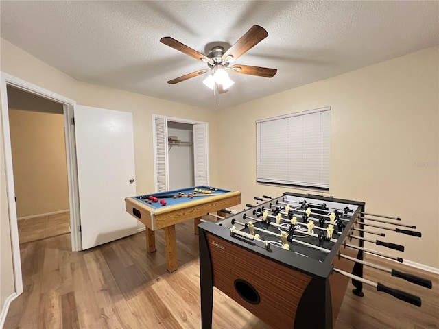 3907 Applegate Cir, Brandon, FL 33511 - recreation room with light wood finished floors, a ceiling fan, pool table, and a textured ceiling