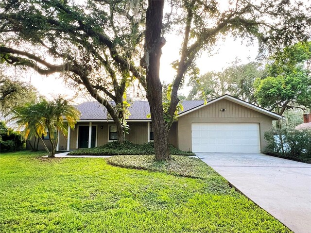 3907 Applegate Cir, Brandon, FL 33511 - ranch-style house featuring driveway, a front lawn, and a garage