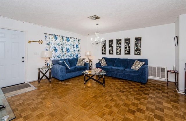 7420 Cay Dr, Port Richey, FL 34668 - living room with a textured ceiling, baseboards, a chandelier, and visible vents