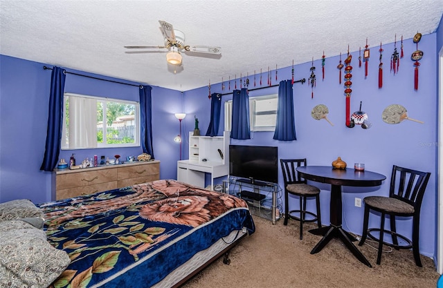 7420 Cay Dr, Port Richey, FL 34668 - carpeted bedroom with a ceiling fan and a textured ceiling