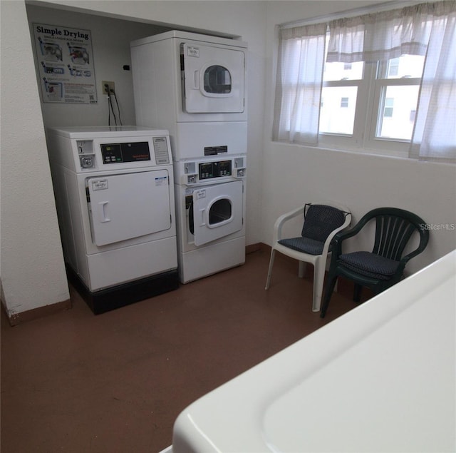 common laundry area featuring separate washer and dryer and stacked washer / drying machine