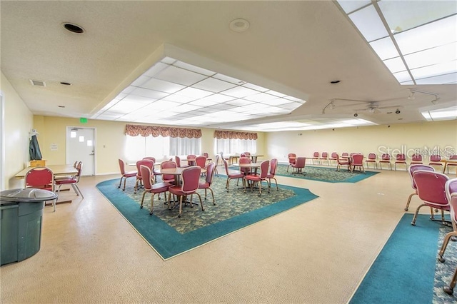 dining area featuring visible vents and a paneled ceiling