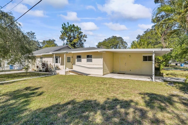 3600 46th St N, Saint Petersburg, FL 33713 - back of house with a carport and a yard
