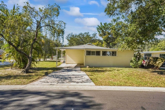 3600 46th St N, Saint Petersburg, FL 33713 - view of front of property with driveway, a front yard, and an attached carport