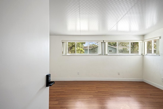 3600 46th St N, Saint Petersburg, FL 33713 - empty room featuring baseboards and wood finished floors