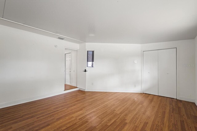 3600 46th St N, Saint Petersburg, FL 33713 - unfurnished room with baseboards and wood finished floors