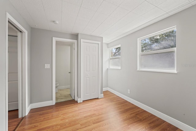 3600 46th St N, Saint Petersburg, FL 33713 - unfurnished bedroom with baseboards and light wood finished floors