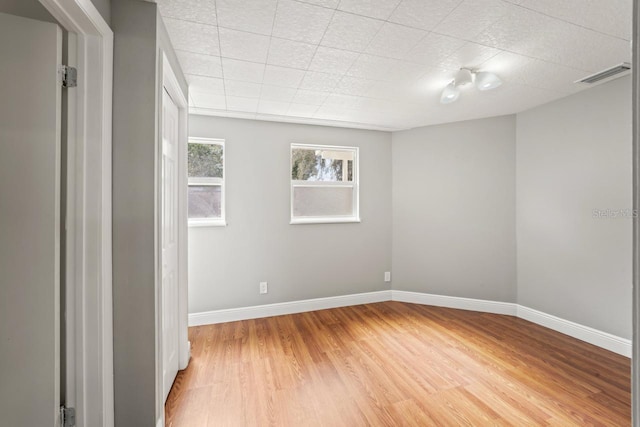 3600 46th St N, Saint Petersburg, FL 33713 - unfurnished room featuring light wood-style floors, baseboards, and visible vents