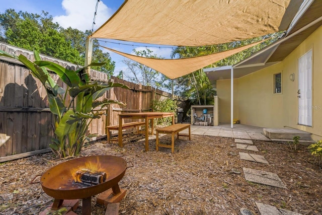 3600 46th St N, Saint Petersburg, FL 33713 - view of yard with a fenced backyard, an outdoor fire pit, and a patio area
