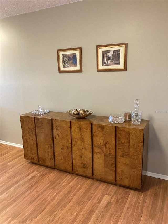 detailed view of wood finished floors and baseboards