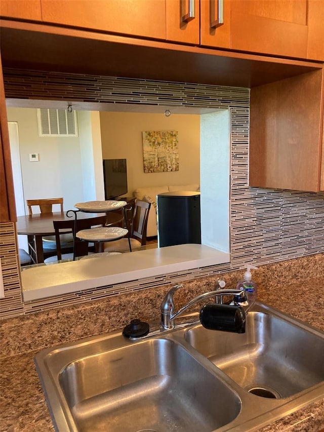 detailed view of a sink and backsplash