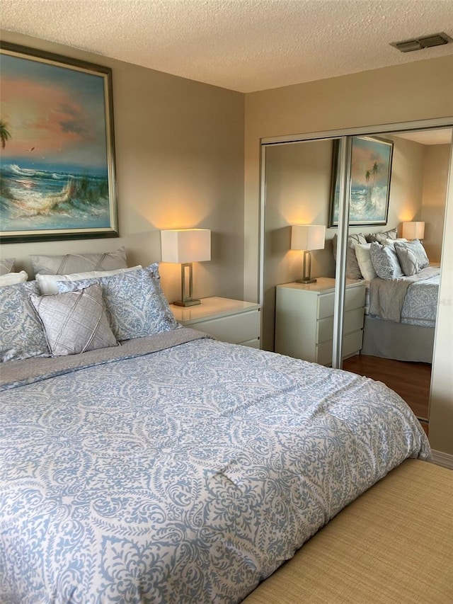 bedroom featuring a closet and a textured ceiling