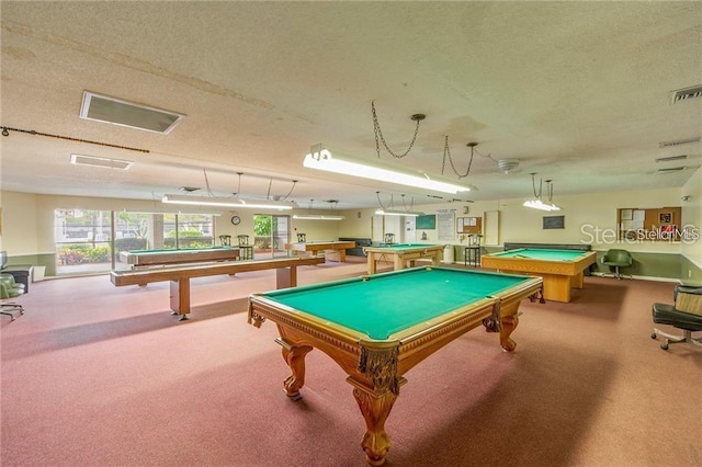 recreation room with billiards, a textured ceiling, and carpet floors