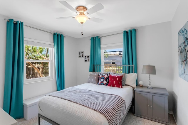 bedroom featuring a ceiling fan and speckled floor
