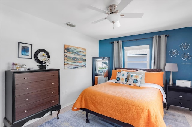 bedroom with ceiling fan, carpet floors, visible vents, and baseboards