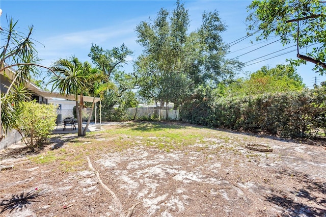 view of yard featuring a patio area and a fenced backyard