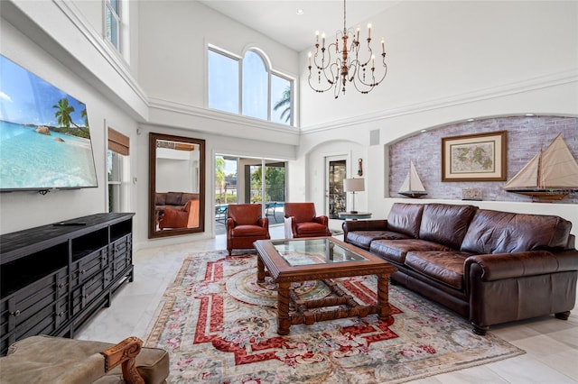 living room featuring a high ceiling and a notable chandelier
