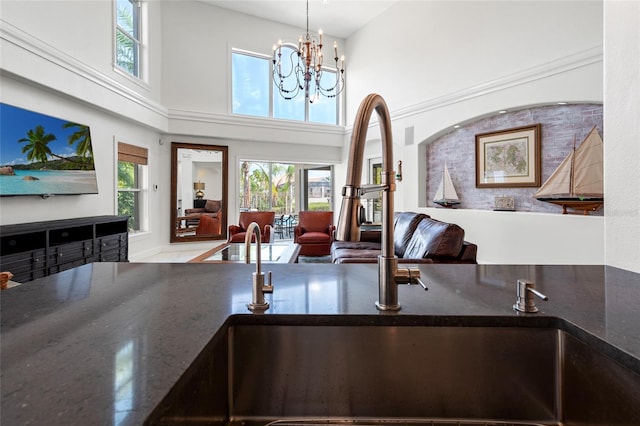room details featuring an inviting chandelier and a sink