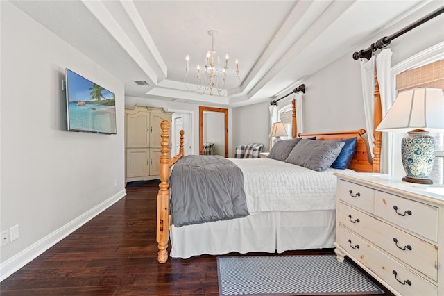 bedroom featuring a raised ceiling, visible vents, dark wood-type flooring, baseboards, and a chandelier