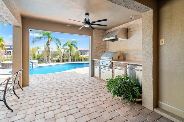 view of pool featuring a grill, area for grilling, fence, ceiling fan, and a pool with connected hot tub