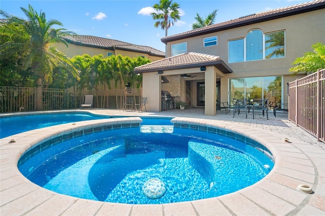 view of pool featuring a patio area, outdoor dining area, fence, a fenced in pool, and ceiling fan