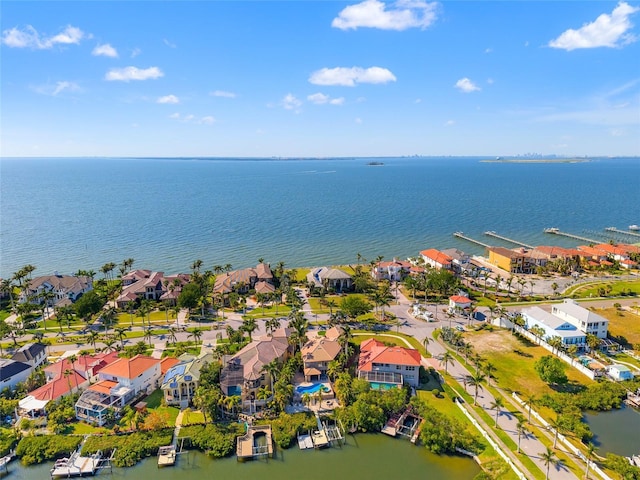 birds eye view of property with a water view and a residential view