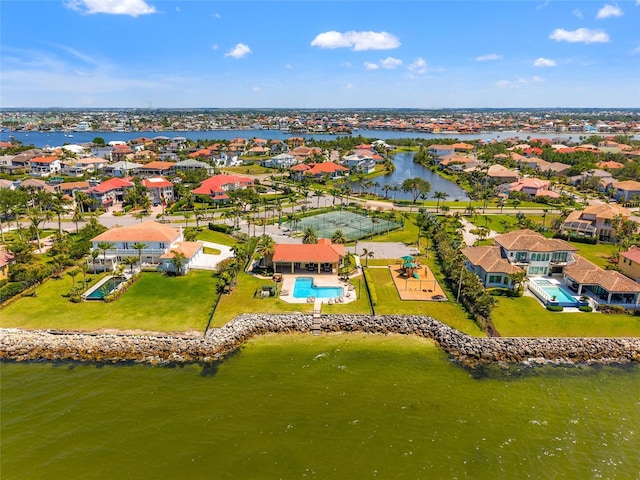 birds eye view of property with a water view and a residential view