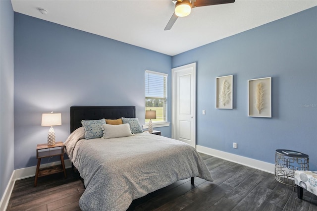 bedroom featuring ceiling fan, baseboards, and dark wood-type flooring