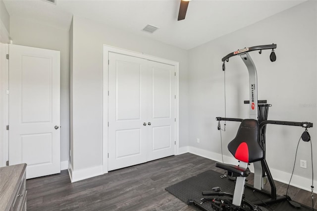 workout area with visible vents, baseboards, wood finished floors, and ceiling fan