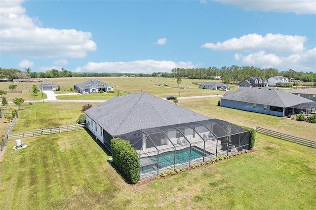 birds eye view of property with a rural view