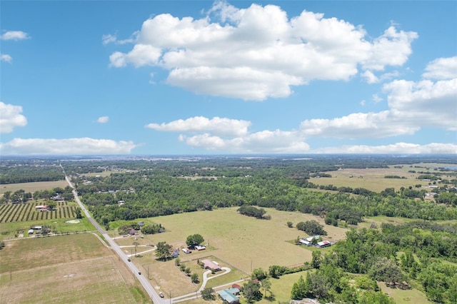 birds eye view of property with a rural view