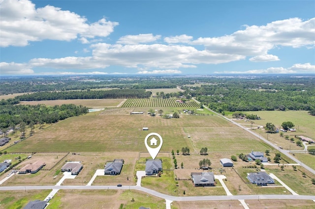 birds eye view of property featuring a rural view