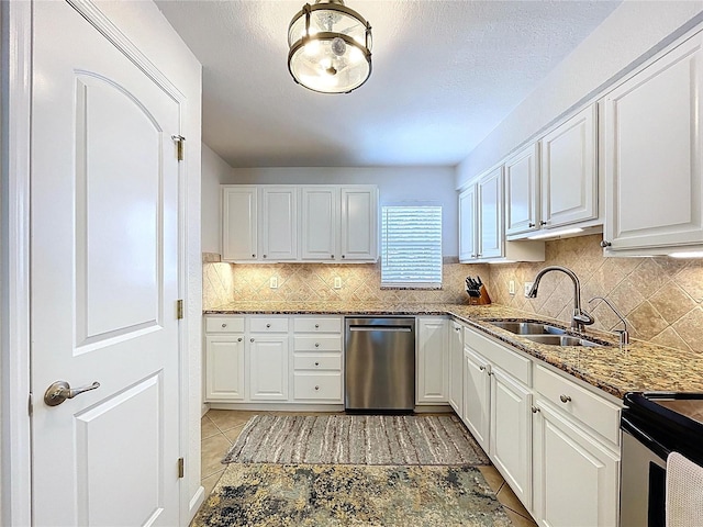 kitchen with a sink, appliances with stainless steel finishes, and white cabinets