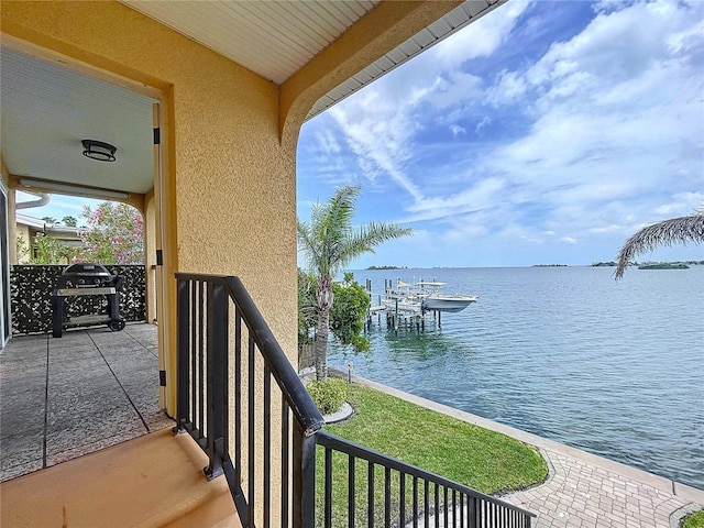 balcony featuring a water view
