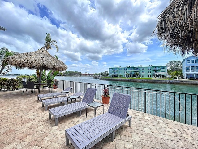 view of patio with a water view