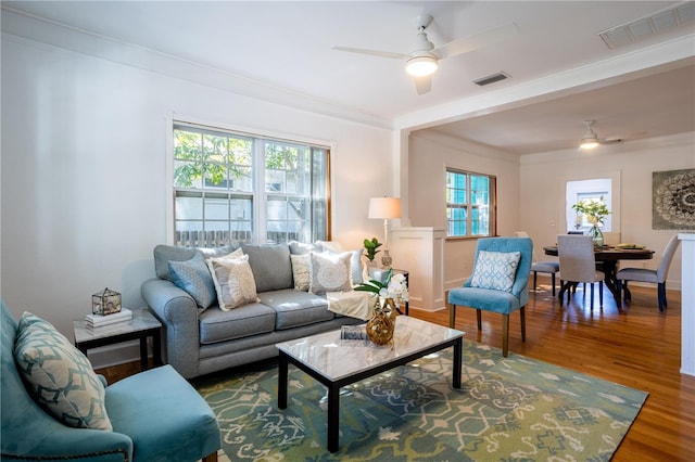 56 W Park St, Tarpon Springs, FL 34689 - living room featuring wood finished floors, a ceiling fan, visible vents, and crown molding