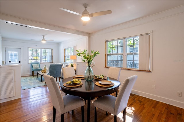 56 W Park St, Tarpon Springs, FL 34689 - dining area with crown molding, baseboards, a ceiling fan, and wood finished floors