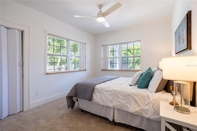 56 W Park St, Tarpon Springs, FL 34689 - carpeted bedroom with baseboards and ceiling fan