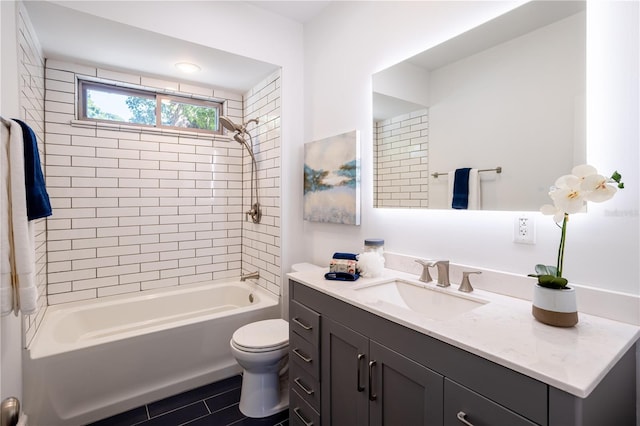56 W Park St, Tarpon Springs, FL 34689 - bathroom with tile patterned flooring, toilet, vanity, and tub / shower combination