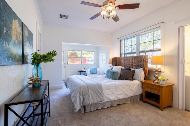 56 W Park St, Tarpon Springs, FL 34689 - carpeted bedroom with visible vents, ornamental molding, a ceiling fan, and multiple windows