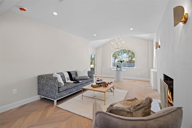 living room featuring lofted ceiling, a large fireplace, and baseboards