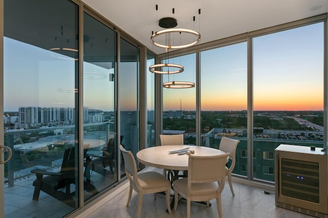 interior space featuring wine cooler, floor to ceiling windows, and a healthy amount of sunlight
