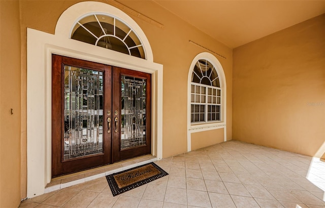 2042 Diamond Ct, Oldsmar, FL 34677 - doorway to property with french doors and stucco siding