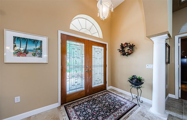 2042 Diamond Ct, Oldsmar, FL 34677 - foyer entrance featuring baseboards, a high ceiling, french doors, and ornate columns