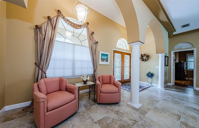 2042 Diamond Ct, Oldsmar, FL 34677 - sitting room with arched walkways, visible vents, baseboards, and decorative columns