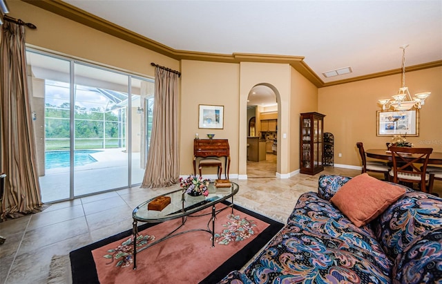 2042 Diamond Ct, Oldsmar, FL 34677 - living room with arched walkways, baseboards, an inviting chandelier, visible vents, and ornamental molding
