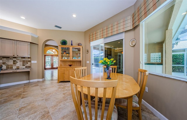 2042 Diamond Ct, Oldsmar, FL 34677 - dining room with baseboards, visible vents, arched walkways, and recessed lighting