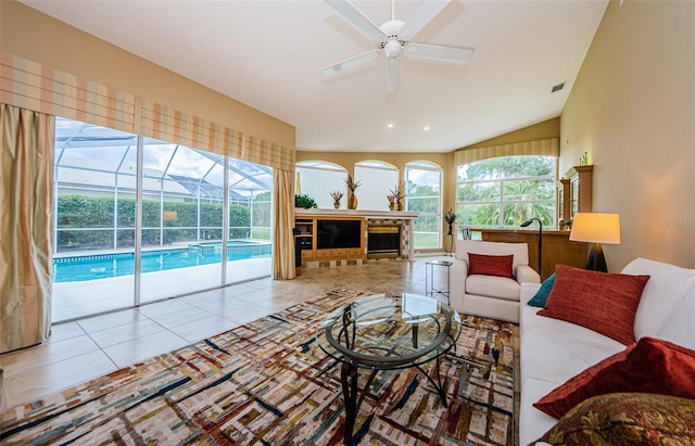 2042 Diamond Ct, Oldsmar, FL 34677 - tiled living room with lofted ceiling, a sunroom, visible vents, and a ceiling fan
