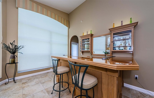 2042 Diamond Ct, Oldsmar, FL 34677 - bar with a wealth of natural light and baseboards