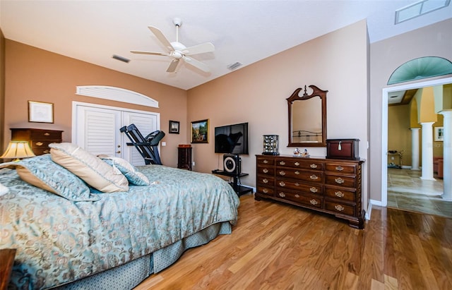 2042 Diamond Ct, Oldsmar, FL 34677 - bedroom with wood finished floors, decorative columns, and visible vents